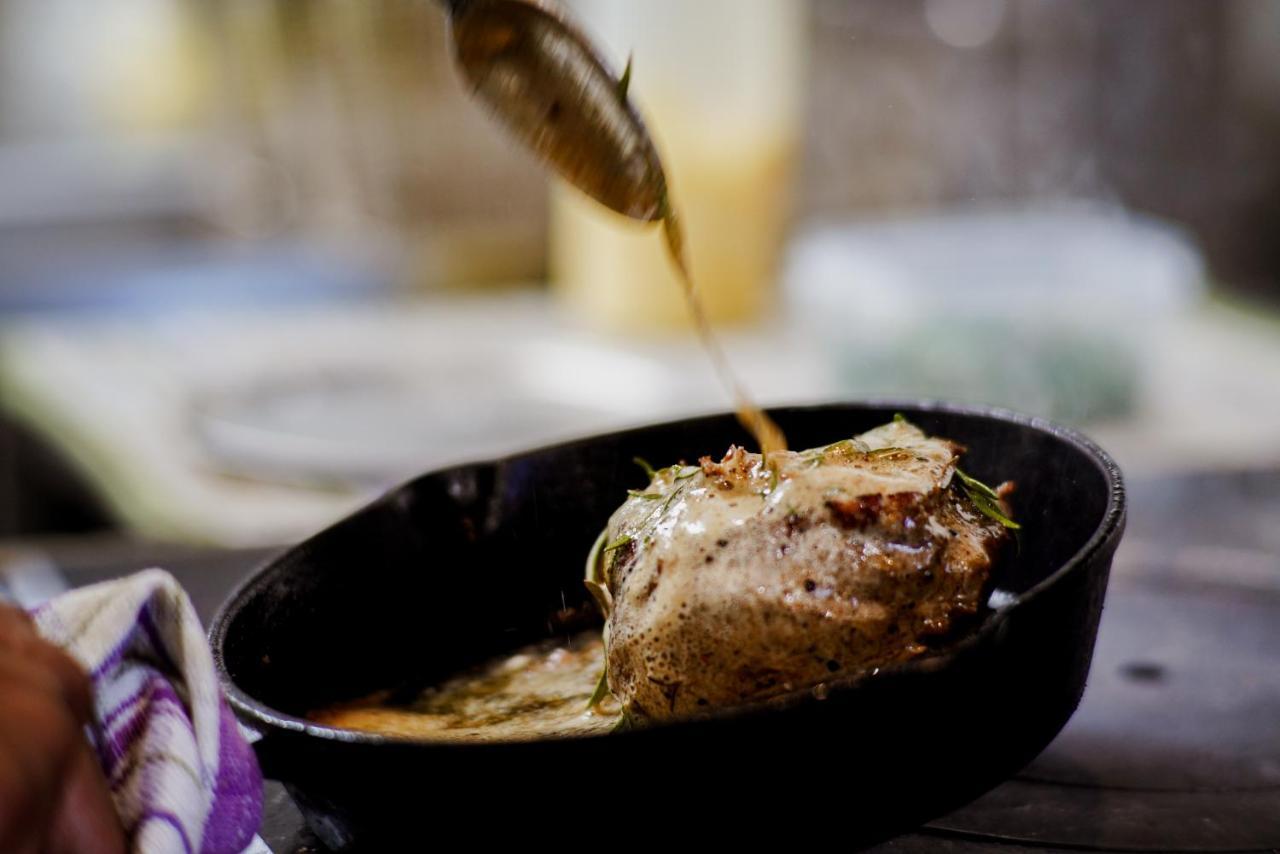 Parehua Resort Martinborough Εξωτερικό φωτογραφία A chef pouring sauce over a steak